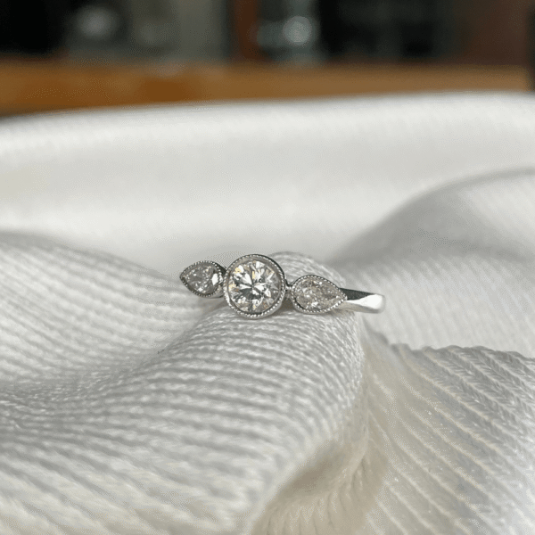 18ct White Gold Diamond Bezel Trilogy Ring