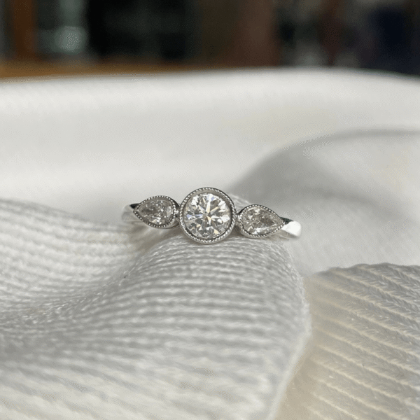 18ct White Gold Diamond Bezel Trilogy Ring