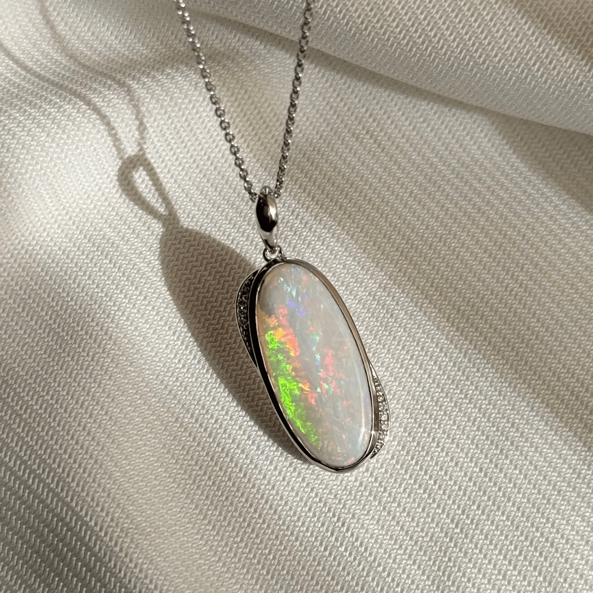 9ct White Gold 5.37ct White Opal & Diamond Pendant