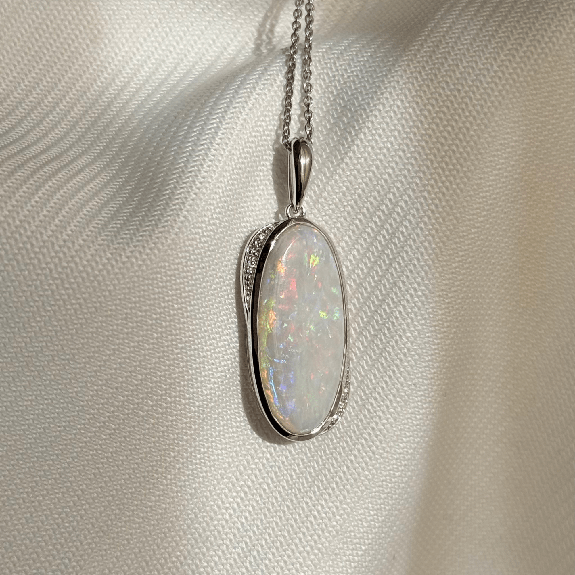 9ct White Gold 5.37ct White Opal & Diamond Pendant