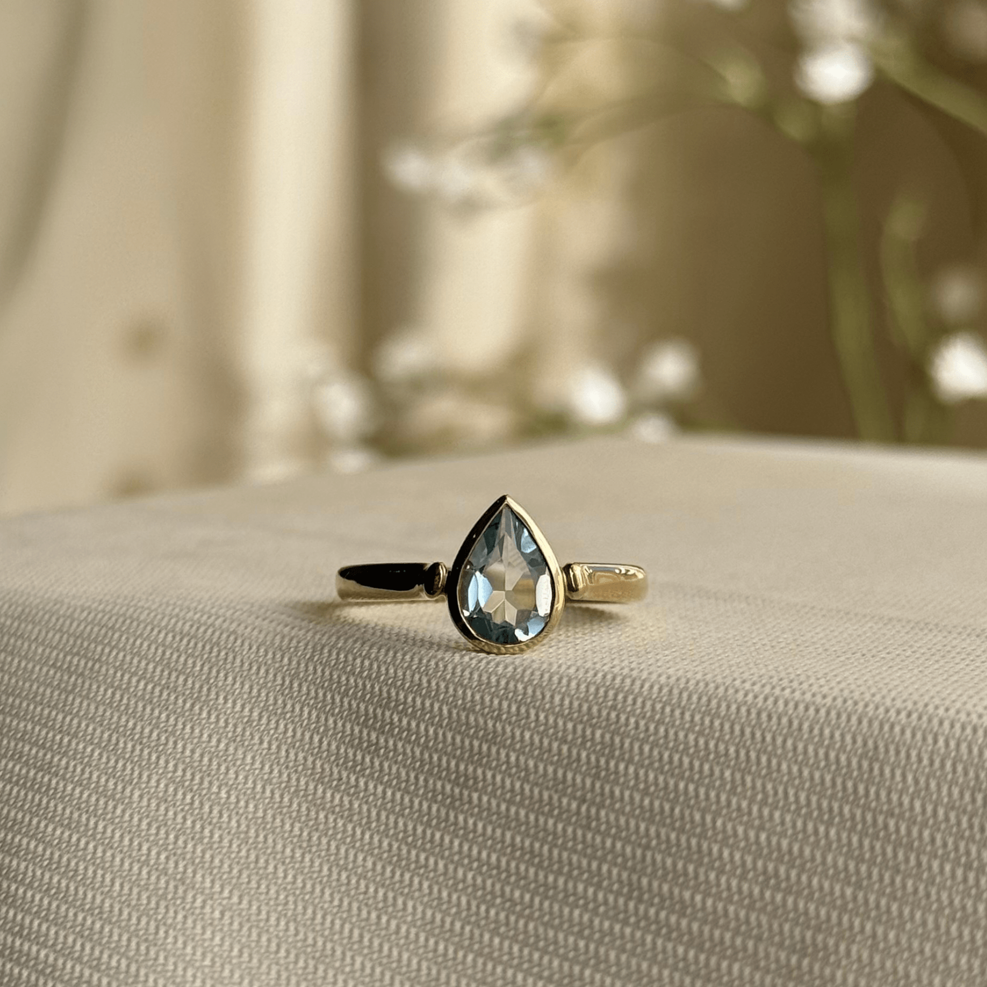9ct Gold Bezel Set Pear Shaped Blue Topaz Ring